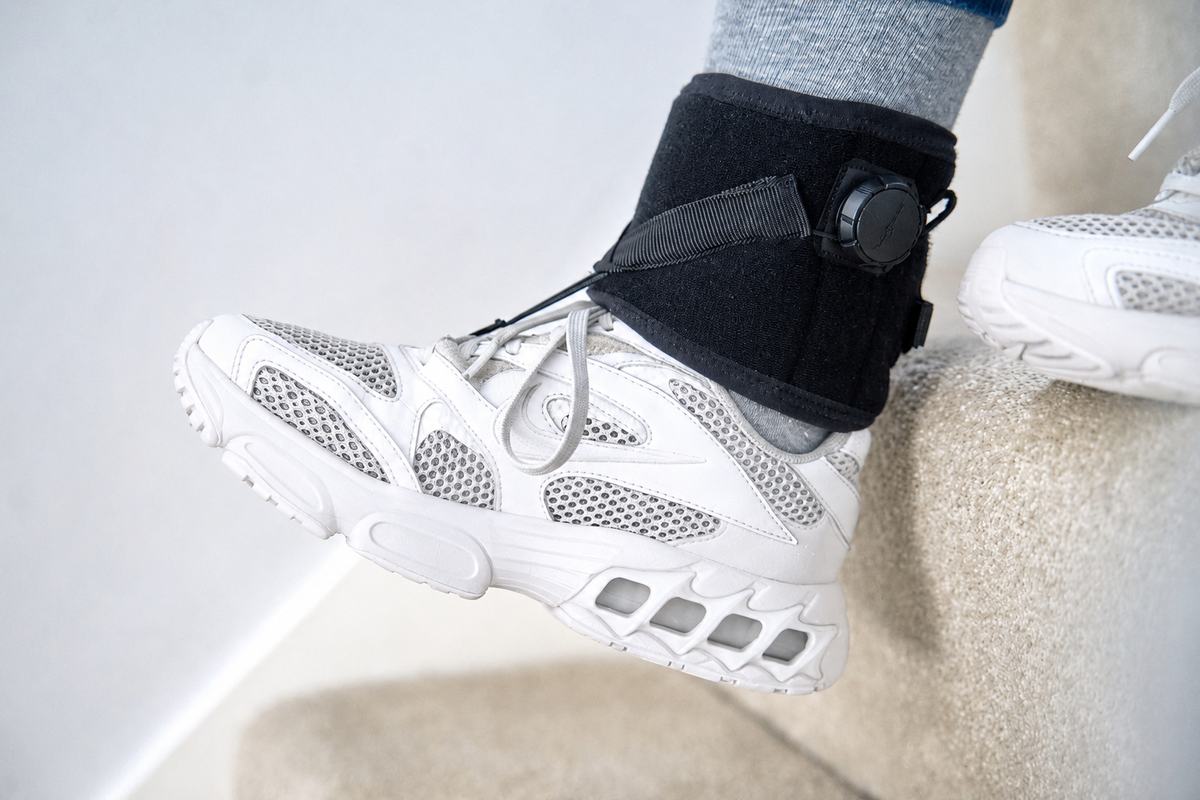 OrthoPed foot drop splint worn while walking down stairs