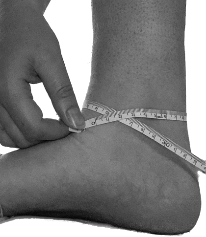 Tape measure wrapped around the widest part of the ankle for OrthoPed splint sizing