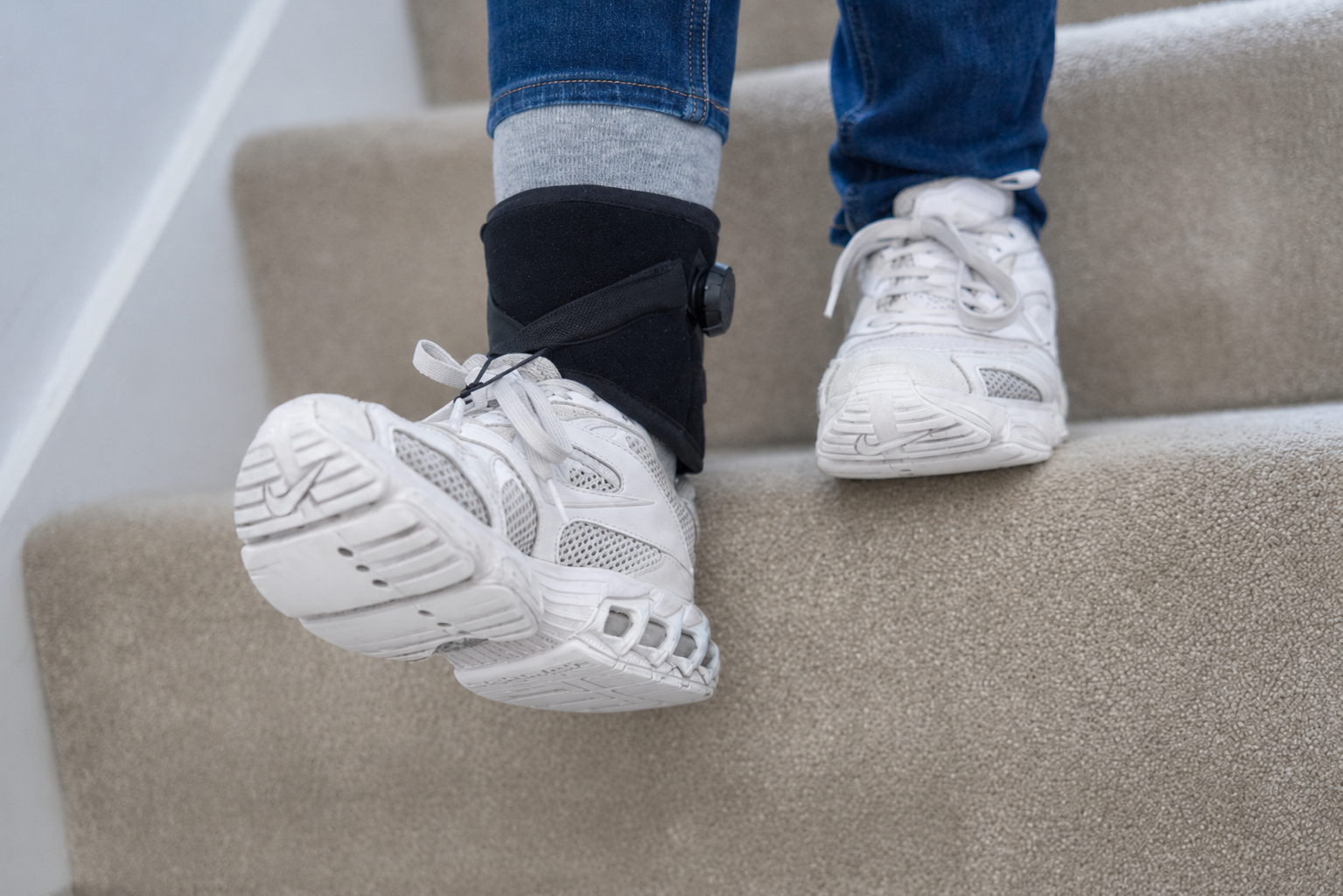 Child wearing a foot support during stair practice